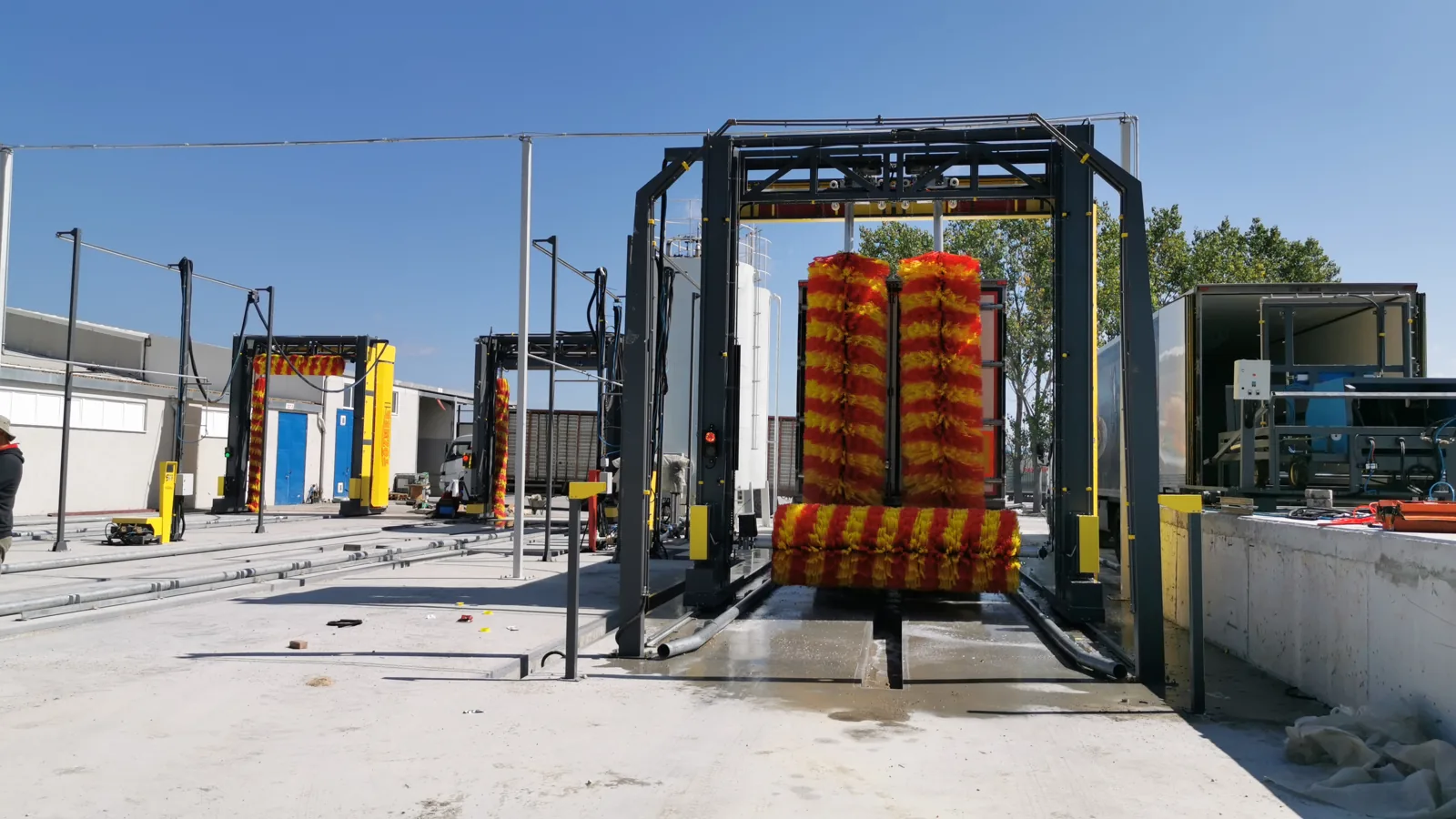 Truck wash gantry on its rails at a depot, seen from behind